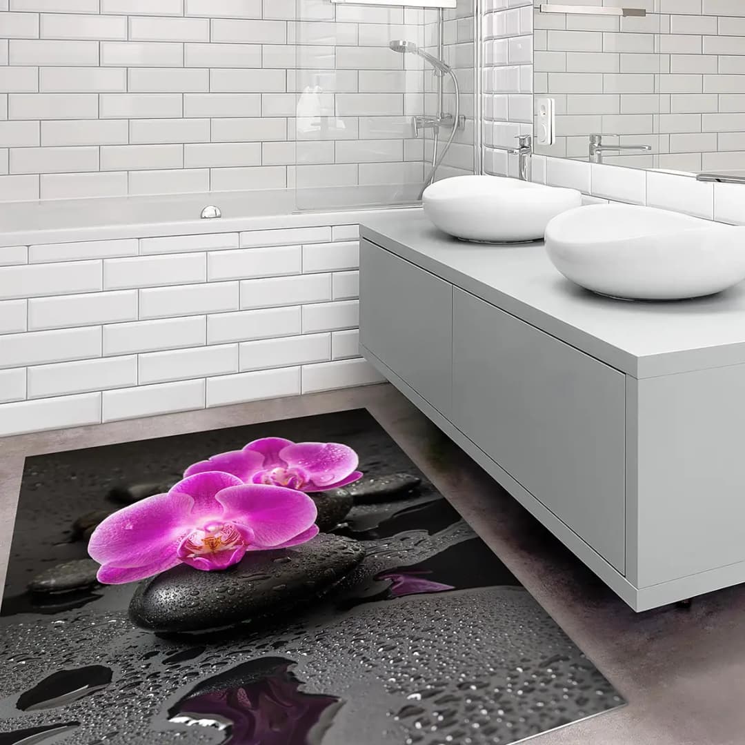 Vinylteppich Orchideenblüten auf Steinen | Pink